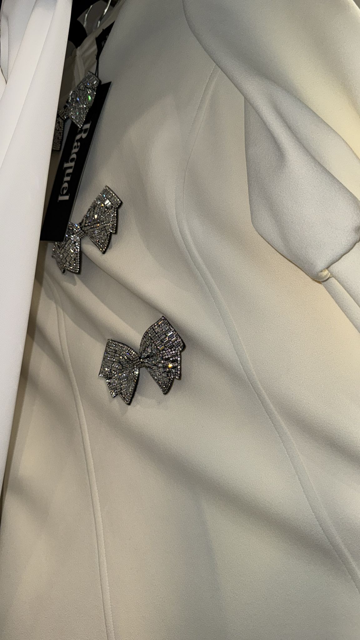 Ivory dress with 3 stone bows