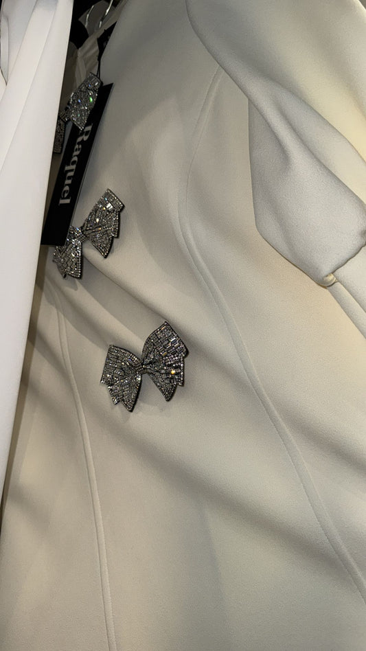 Ivory dress with 3 stone bows